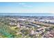 Aerial view showing the community's proximity to Tampa Bay, shopping, green spaces, and recreational areas at 11 Quails Run Blvd # 9, Englewood, FL 34223