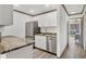 Modern kitchen with stainless steel appliances and white cabinets at 11 Quails Run Blvd # 9, Englewood, FL 34223
