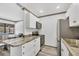 Modern kitchen with stainless steel appliances and plenty of counter space at 11 Quails Run Blvd # 9, Englewood, FL 34223