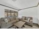 Spacious living room featuring hardwood floors and comfortable seating at 11 Quails Run Blvd # 9, Englewood, FL 34223