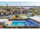 Community pool area featuring ample seating, clear blue water, and recreational facilities for residents at 11 Quails Run Blvd # 9, Englewood, FL 34223