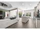 Open-concept living space with modern flooring, spacious layout, kitchen island, and recessed lighting at 11085 Sunnydale Ave, Englewood, FL 34224