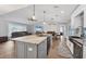 Open kitchen features a large island, stainless steel appliances, and seamless flow into the living areas at 11101 Sandrift Ave, Englewood, FL 34224