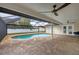 Inviting screened-in pool area with brick pavers and ample space for lounging at 11101 Sandrift Ave, Englewood, FL 34224