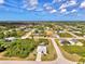 Beautiful aerial shot of the single Gathering home and landscape in a quiet neighborhood at 115 Australian Dr, Rotonda West, FL 33947
