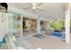 Relaxing screened lanai offering indoor/outdoor living with views of the pool and interior of the home at 115 Australian Dr, Rotonda West, FL 33947