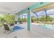 Enclosed patio featuring views of the pool and backyard landscaping with ample seating at 115 Australian Dr, Rotonda West, FL 33947