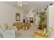 Inviting living room with wicker furniture and an open layout, ideal for Gathering gatherings and casual living at 115 Australian Dr, Rotonda West, FL 33947