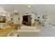 Spacious living area with wicker furniture, entertainment center, and open layout, perfect for relaxation and gatherings at 115 Australian Dr, Rotonda West, FL 33947