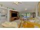 Cozy living room with wicker furniture and modern entertainment center, perfect for relaxing and entertaining guests at 115 Australian Dr, Rotonda West, FL 33947