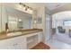 Bathroom featuring a vanity with drawers and cabinetry, plus a large mirror at 115 Australian Dr, Rotonda West, FL 33947