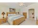 Cozy bedroom with bamboo furniture, ceiling fan, and a neutral color scheme at 115 Australian Dr, Rotonda West, FL 33947