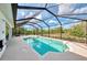 Private pool area with screened enclosure, offering a perfect spot for relaxation and recreation at 115 Australian Dr, Rotonda West, FL 33947