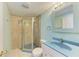 Well-lit bathroom with a tiled shower and a unique vanity, providing a clean and functional space at 1160 Sharlo Cir, Englewood, FL 34224