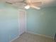 Fresh bedroom featuring a ceiling fan, neutral decor, and simple closet at 1160 Sharlo Cir, Englewood, FL 34224
