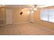 Inviting living room featuring tile floors, ceiling fan, and windows at 1160 Sharlo Cir, Englewood, FL 34224