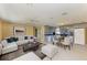 Open-concept living room and kitchen with tile flooring and a bright, inviting atmosphere at 1160 Sharlo Cir, Englewood, FL 34224