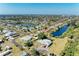 Breathtaking aerial view of the community homes, canals, lakes, and landscaped yards at 1278 Lincoln Dr, Englewood, FL 34224