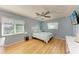 The comfortable bedroom offers a ceiling fan, windows for natural light and neutral-toned walls at 1278 Lincoln Dr, Englewood, FL 34224