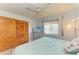 Bedroom with ceiling fan, updated TV, closet, and cozy queen bed, perfect for relaxation at 1278 Lincoln Dr, Englewood, FL 34224