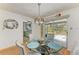 The dining area includes a glass table with seating for four and a view to the kitchen at 1278 Lincoln Dr, Englewood, FL 34224