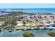 Waterfront houses with private docks provide direct access to scenic bay waters, perfect for boating and enjoying coastal views at 140 Crestview Dr, Englewood, FL 34223
