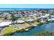 Gorgeous waterfront homes boasting private docks and boatlifts along tranquil canals, offering scenic coastal living at 140 Crestview Dr, Englewood, FL 34223