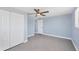 The bedroom features a ceiling fan, closet, and neutral colors at 140 Crestview Dr, Englewood, FL 34223