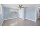 This is a cozy bedroom with a ceiling fan and a closet at 140 Crestview Dr, Englewood, FL 34223
