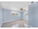 A bright bedroom with two windows and a ceiling fan at 140 Crestview Dr, Englewood, FL 34223