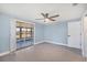 Bedroom featuring a ceiling fan and access to the lanai at 140 Crestview Dr, Englewood, FL 34223