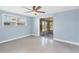 The bedroom has access to a screened-in porch and fan at 140 Crestview Dr, Englewood, FL 34223