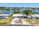 Charming home with well-maintained lawn, a circular driveway, and inviting curb appeal near tranquil waters at 140 Crestview Dr, Englewood, FL 34223