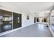 The lanai has tiled floors and walls of windows at 140 Crestview Dr, Englewood, FL 34223