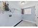 An efficient utility room with a water heater and shelving at 140 Crestview Dr, Englewood, FL 34223