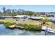Scenic waterfront view showcasing docks and nearby homes at 140 Crestview Dr, Englewood, FL 34223