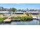 Waterfront view featuring dock and backyard at 140 Crestview Dr, Englewood, FL 34223