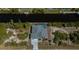 Aerial view of a beautiful home on a canal, with a screened-in pool and patio at 14526 Fort Worth Cir, Port Charlotte, FL 33981