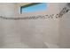 Shower stall with mosaic tile accent and a window for natural light at 14526 Fort Worth Cir, Port Charlotte, FL 33981