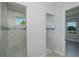 Bathroom with a double shower, mosaic tile accent, and a window for natural light at 14526 Fort Worth Cir, Port Charlotte, FL 33981