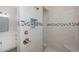 Bathroom with tiled walk-in shower, mosaic tile accent, and vanity with modern fixtures at 14526 Fort Worth Cir, Port Charlotte, FL 33981