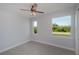 Bright bedroom with abundant natural light, ceiling fan and hardwood-style floors at 14526 Fort Worth Cir, Port Charlotte, FL 33981