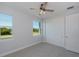 Well-lit bedroom with ample closet space and views of nature at 14526 Fort Worth Cir, Port Charlotte, FL 33981