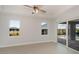 Bright bedroom with tile floors, ceiling fan and sliding glass doors to pool at 14526 Fort Worth Cir, Port Charlotte, FL 33981