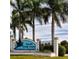 Entrance to South Gulf Cove, a waterfront community with lush landscaping and palm trees, welcoming residents at 14526 Fort Worth Cir, Port Charlotte, FL 33981
