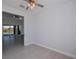 An empty room featuring tile floors and a view of the outdoor living area at 14526 Fort Worth Cir, Port Charlotte, FL 33981