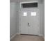 Double front doors with windows above and a clean, modern design at 14526 Fort Worth Cir, Port Charlotte, FL 33981