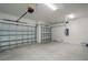Spacious three car garage with durable concrete flooring and garage door openers at 14526 Fort Worth Cir, Port Charlotte, FL 33981