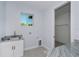 Well-equipped laundry room with granite countertops, sink, and ample storage space at 14526 Fort Worth Cir, Port Charlotte, FL 33981