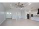 Bright and spacious living room, front doors, and view of the kitchen give an open and welcome feel at 14526 Fort Worth Cir, Port Charlotte, FL 33981